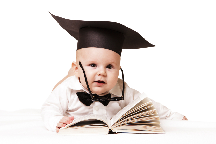 Baby in academician clothes with book