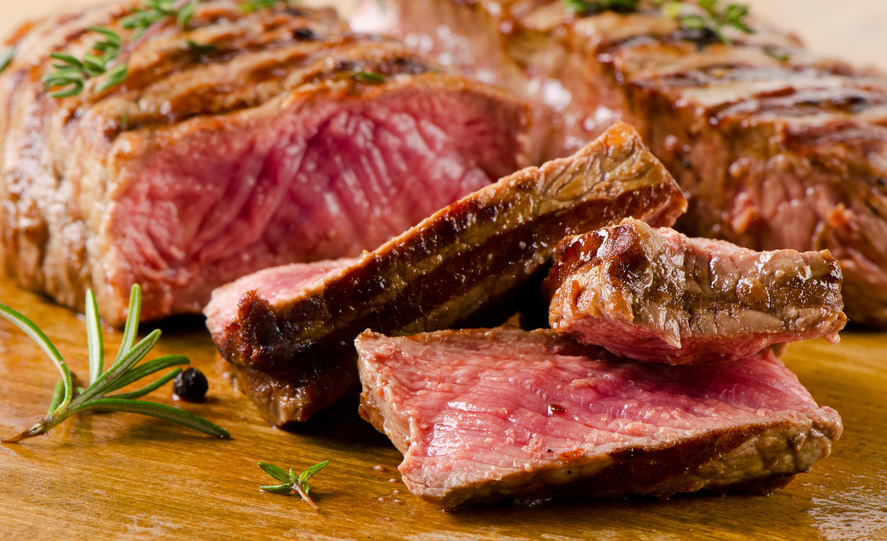 Beef steak on cutting board. Selective focus